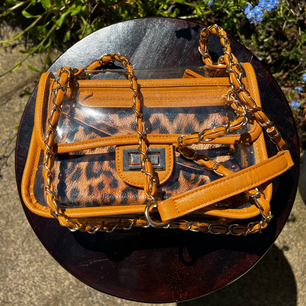 Animal print purse with adjustable strap. Completely removable pouch.